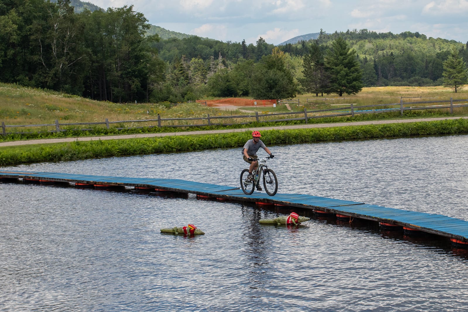 HEB racer biking over the bridge